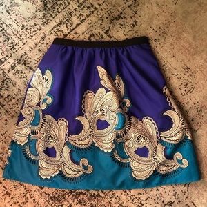 It has POCKETS! Knee length A-lined print skirt